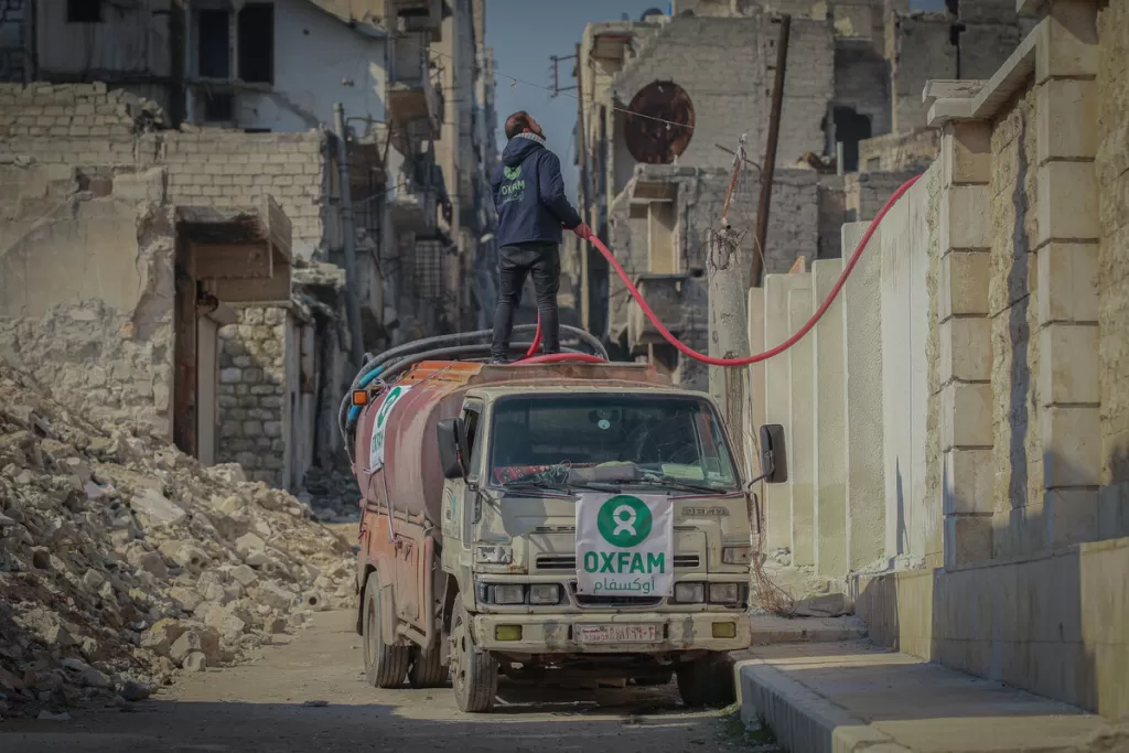 An Oxfam water truck provides water to earthquake survivors in Syria